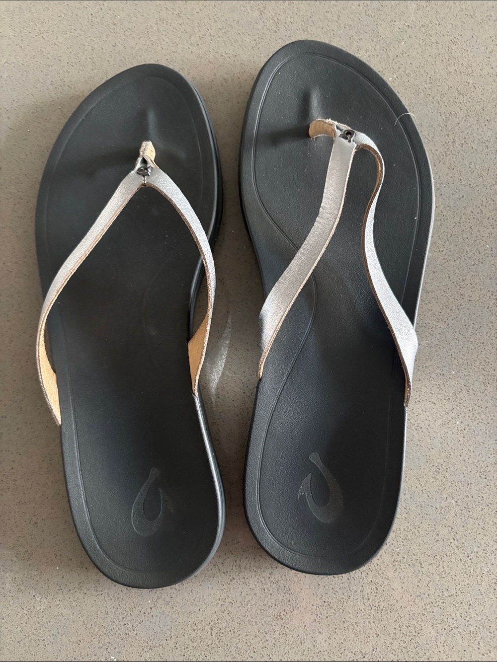 OluKai Black Footbed Sandals with Leather Silver Straps